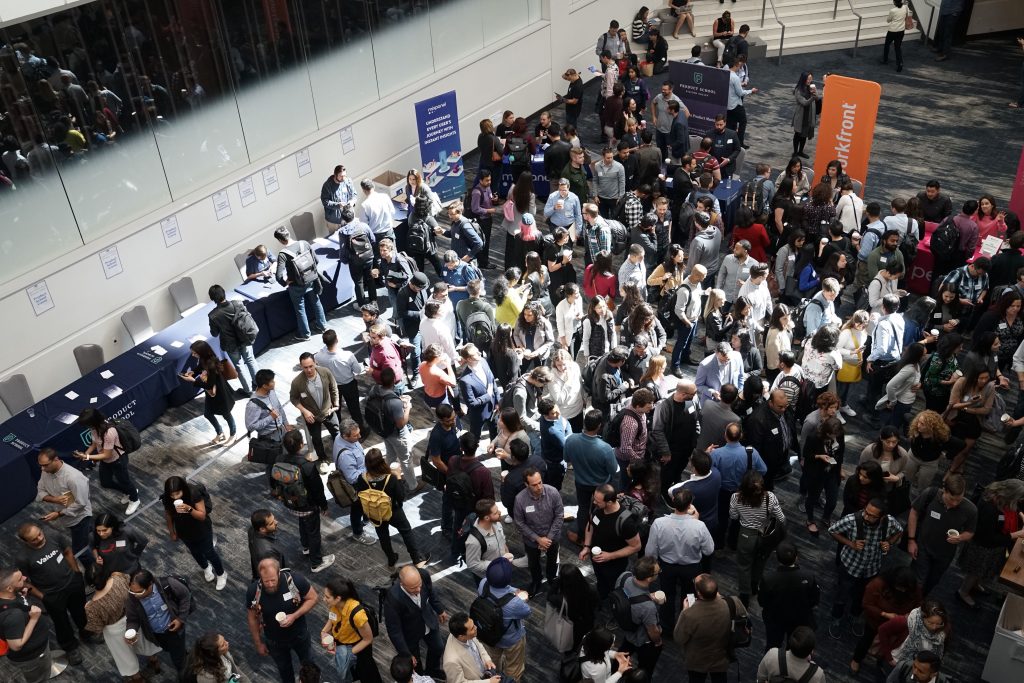 A large group of people in a convention center.